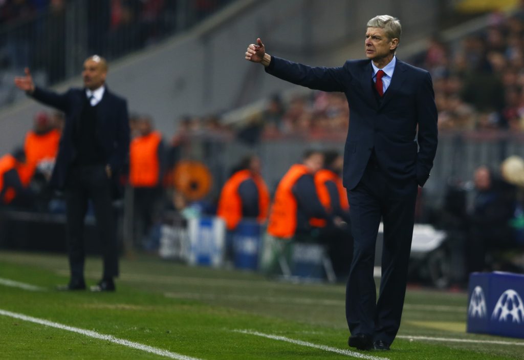 Arsene Wenger (R) reacts next to Pep Guardiola.