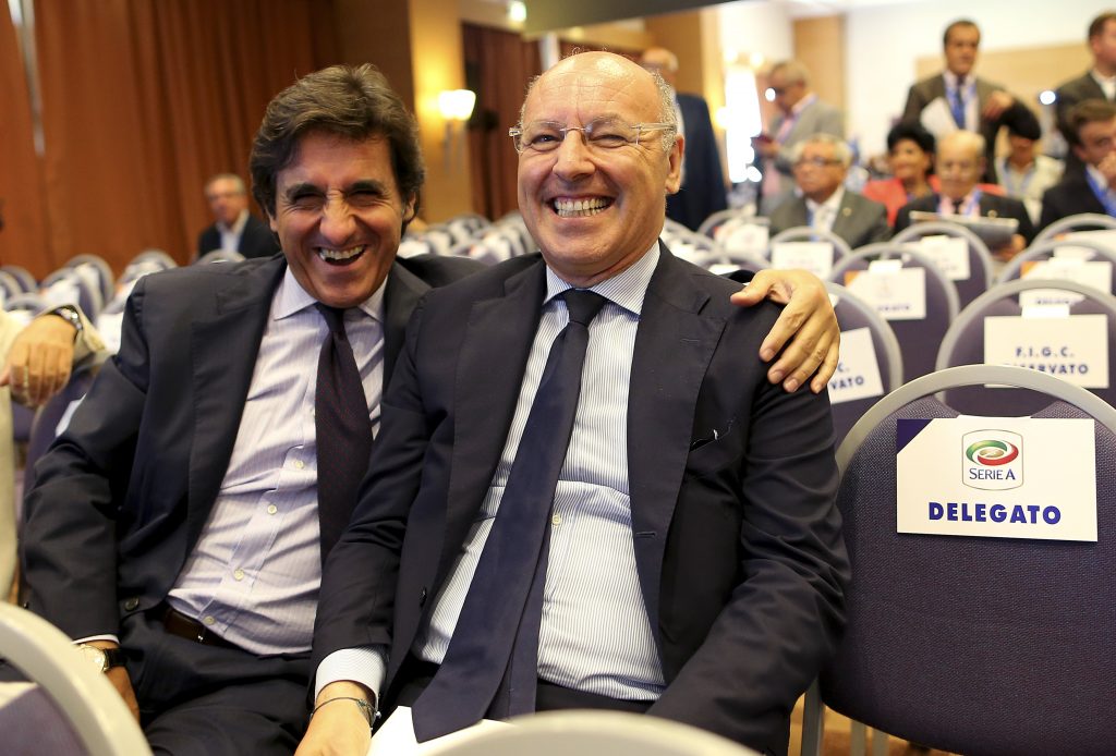 Juventus Sporting Director Giuseppe Marotta (R) and Torino president Urbano Cairo smile as they arrive at an election for the Italian Football Federation (FIGC) presidency in Rome.