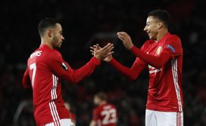 Jesse Lingard celebrates scoring their fourth goal with Memphis Depay.