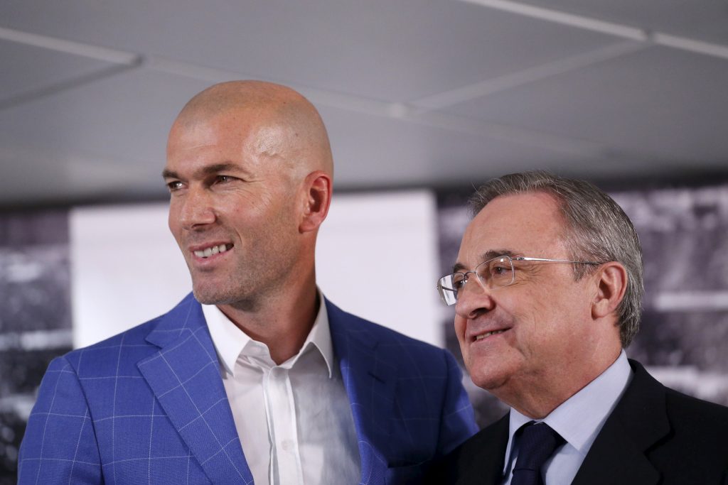 Zinedine Zidane (L) and Real Madrid's President Florentino Perez pose for the media.