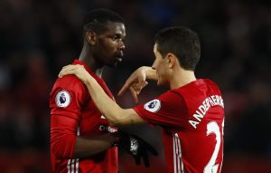 Paul Pogba speaks with Ander Herrera.