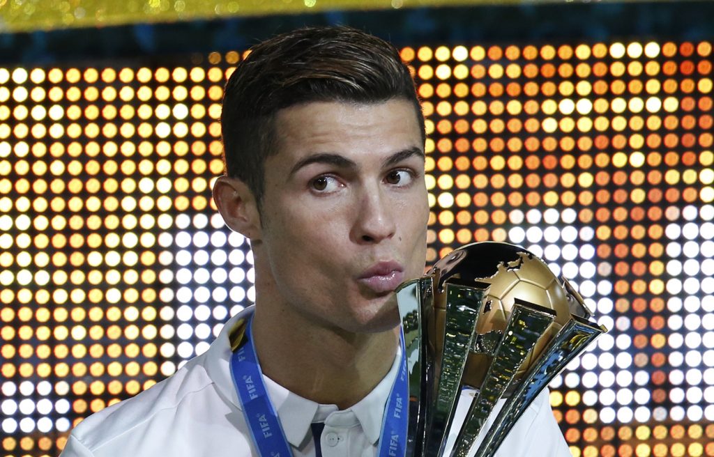 Cristiano Ronaldo celebrates winning the FIFA Club World Cup Final with the trophy.