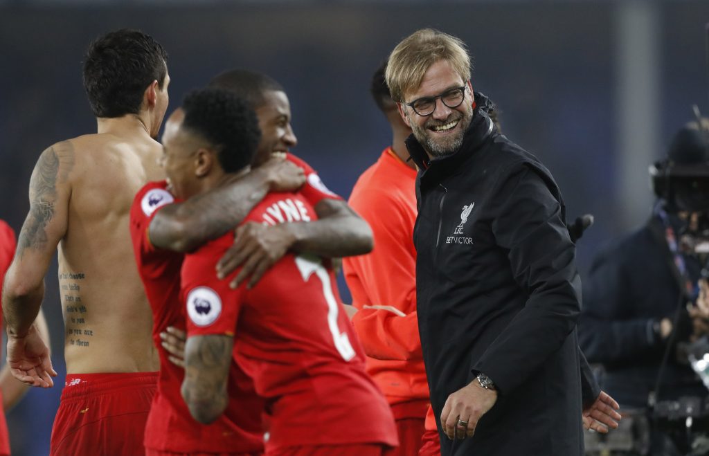 Jurgen Klopp celebrates after the match with players.