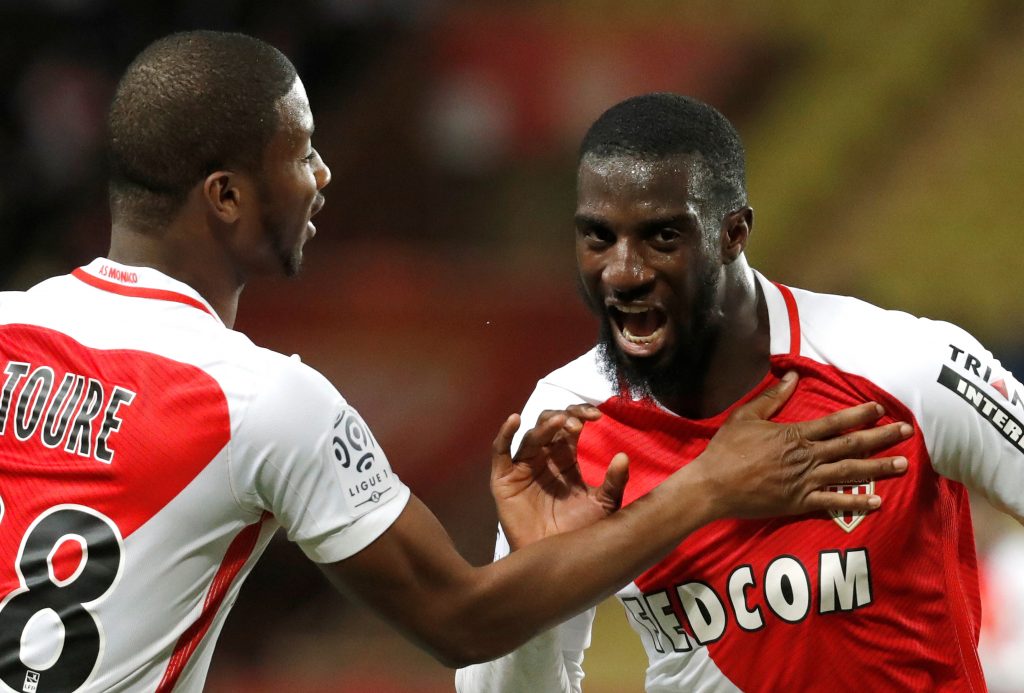 Tiemoue Bakayoko (R) celebrates with teammate Almamy Toure after scoring.