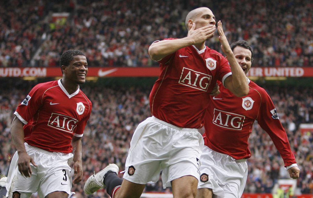 Manchester United's Rio Ferdinand celebrates with team mates Patrice Evra (L) and Ryan Giggs (R).