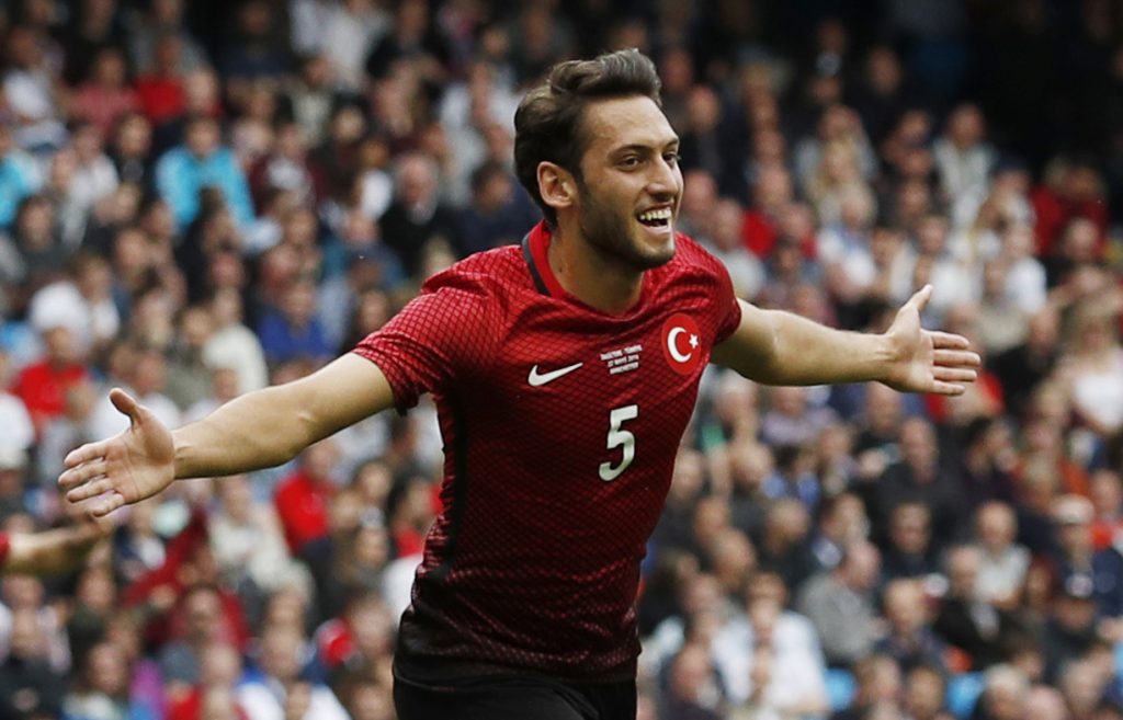 Hakan Calhanoglu celebrates after scoring the first goal for Turkey.