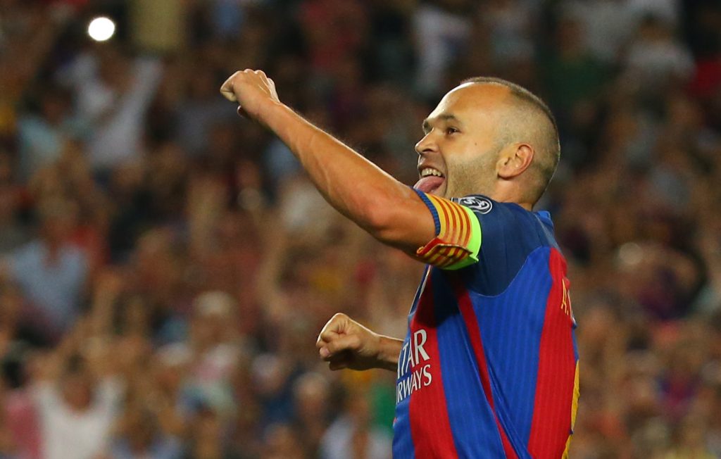 Barcelona's Andres Iniesta celebrates scoring their fourth goal.