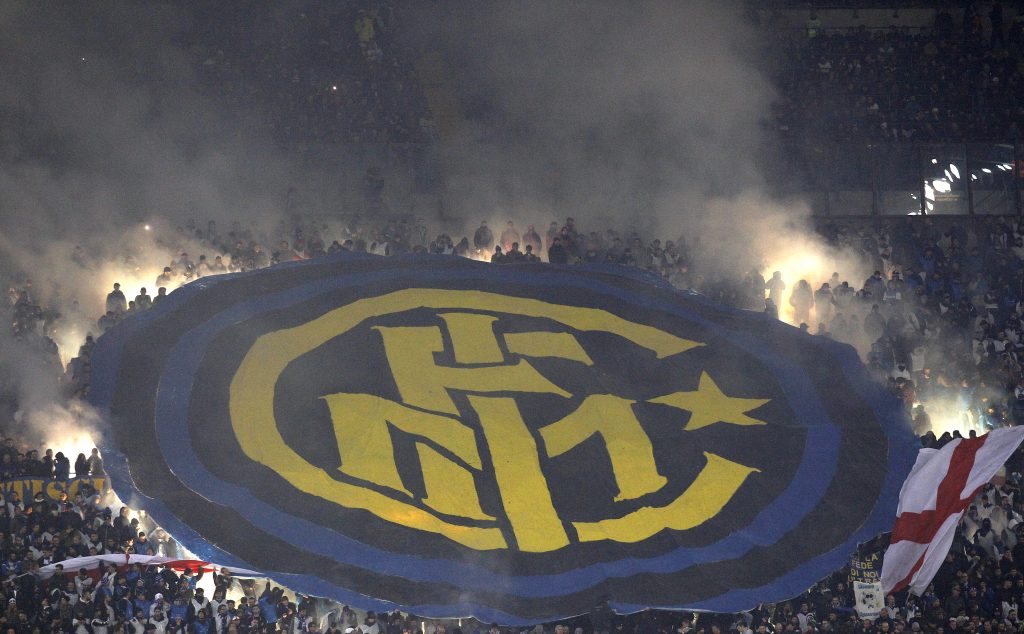 Inter Milan's supporters hold up a giant banner during the match.