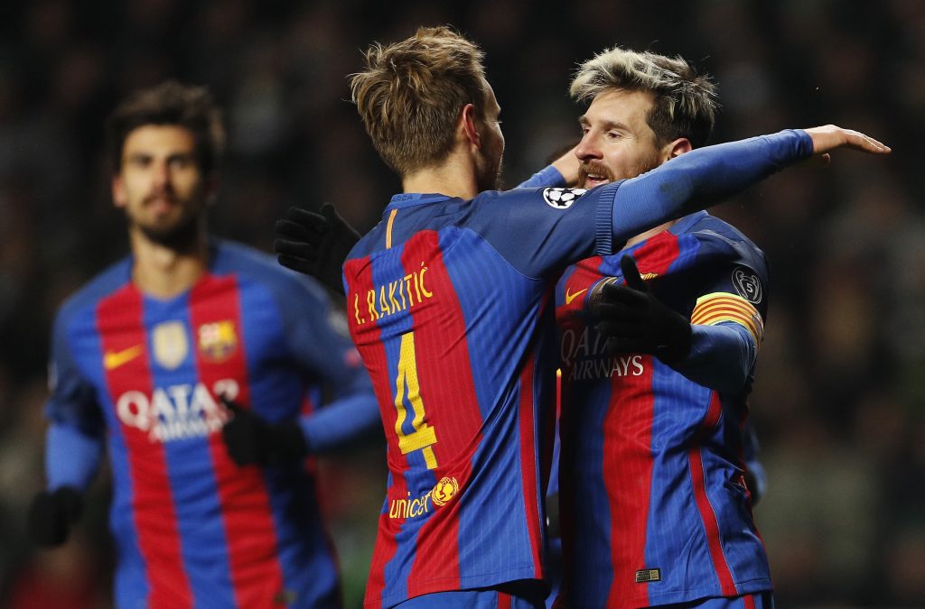 Barcelona's Luis Suarez celebrates scoring their second goal with Ivan Rakitic.
