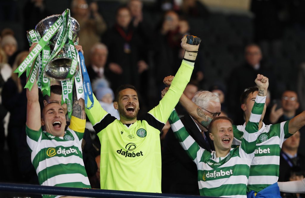 Celtic's Scott Brown, Craig Gordon and Leigh Grifiths celebrate winning the final with the trophy.