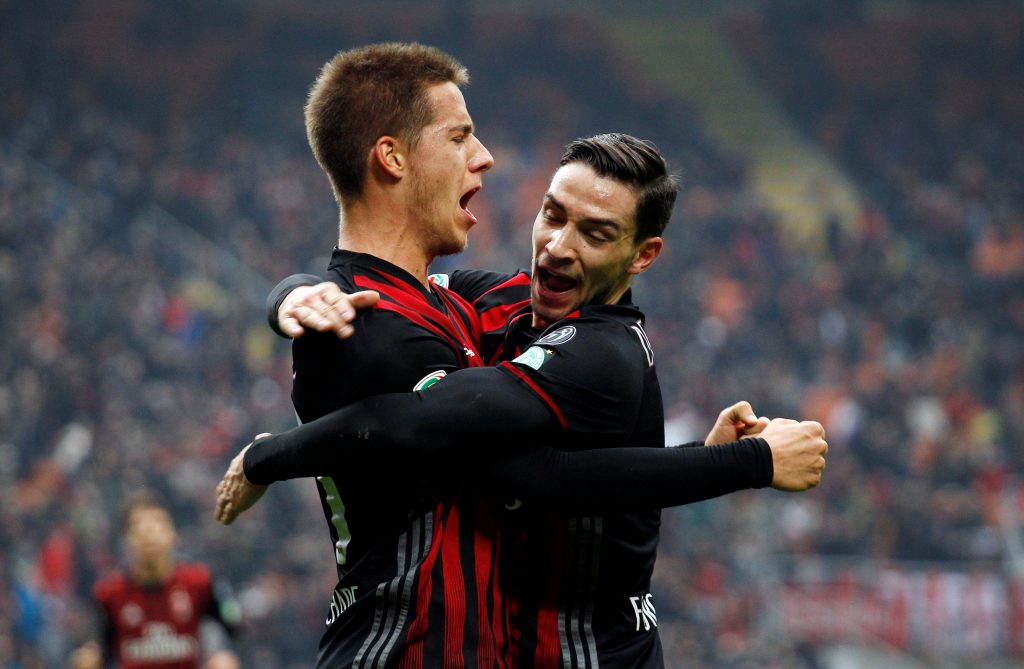 AC Milan's Mario Pasalic celebrates with his team mate Mattia De Sciglio after scoring.