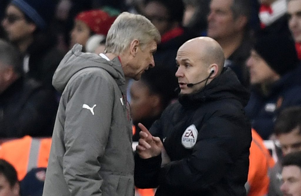 Arsenal manager Arsene Wenger clashes with fourth official Anthony Taylor.