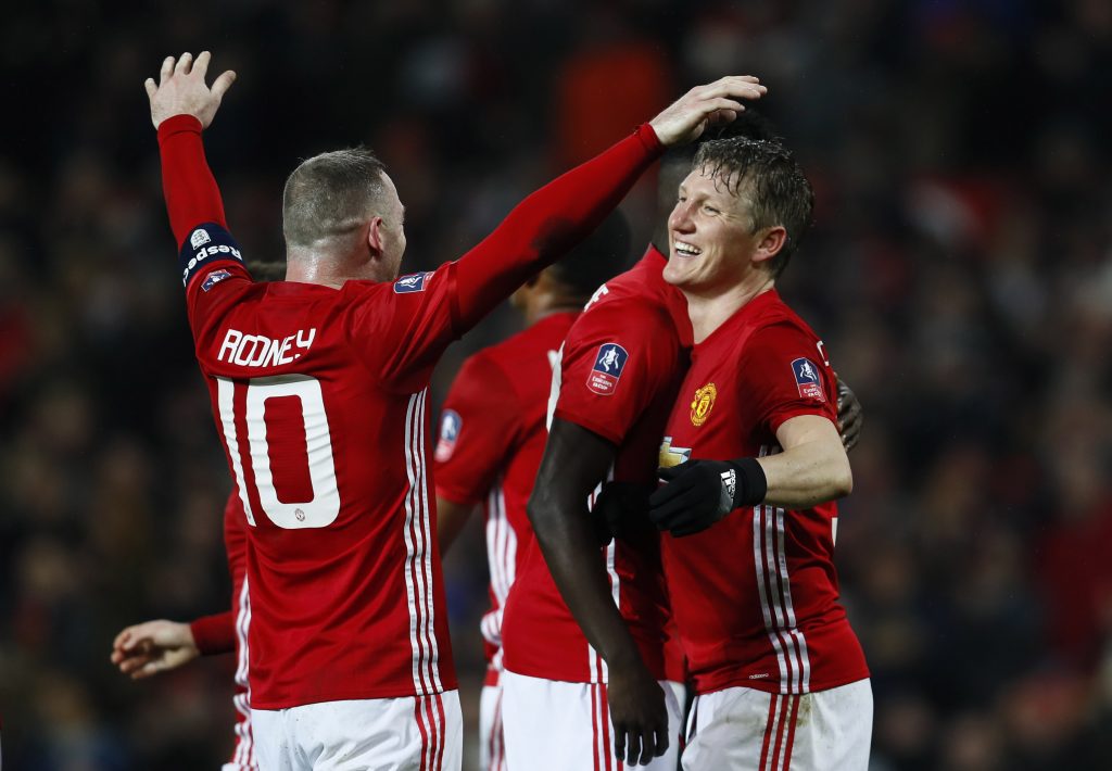 Manchester United's Bastian Schweinsteiger celebrates scoring their fourth goal with Wayne Rooney.