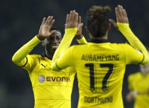 Borussia Dortmund's Pierre-Emerick Aubameyang celebrates the fourth goal against VfB Stuttgart with Adrian Ramos.