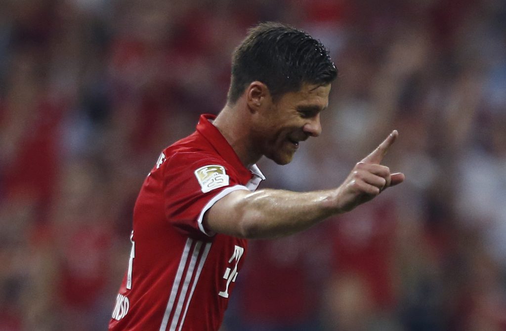 Bayern Munich's Xabi Alonso celebrates after scoring the first goal against Werder Bremen.