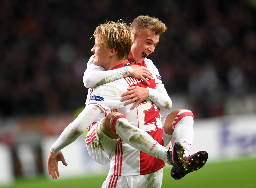 Ajax Amsterdam's Kasper Dolberg and Daley Sinkgraven celebrate a score.
