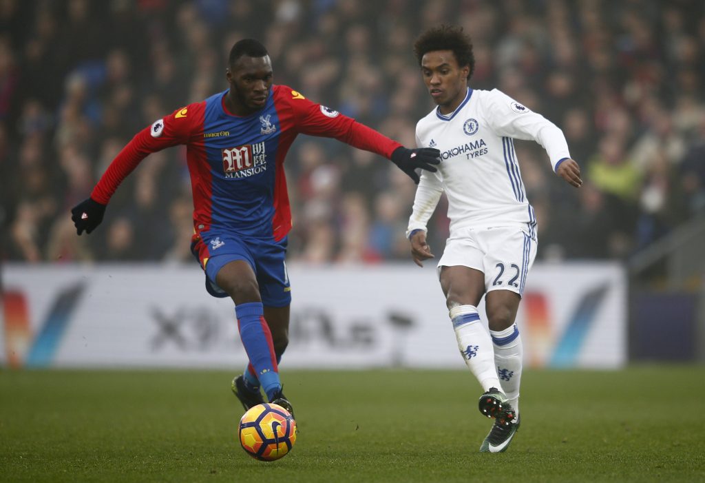 Christian Benteke in action with Chelsea's Willian.