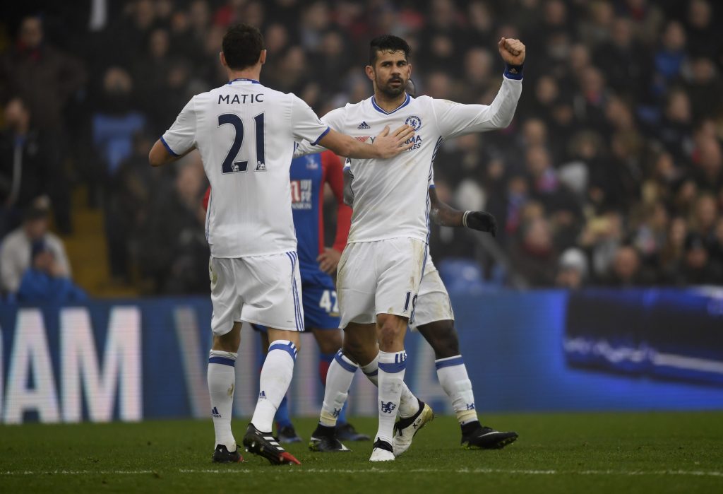 Costa celebrates scoring Chelsea's first goal with Nemanja Matic.