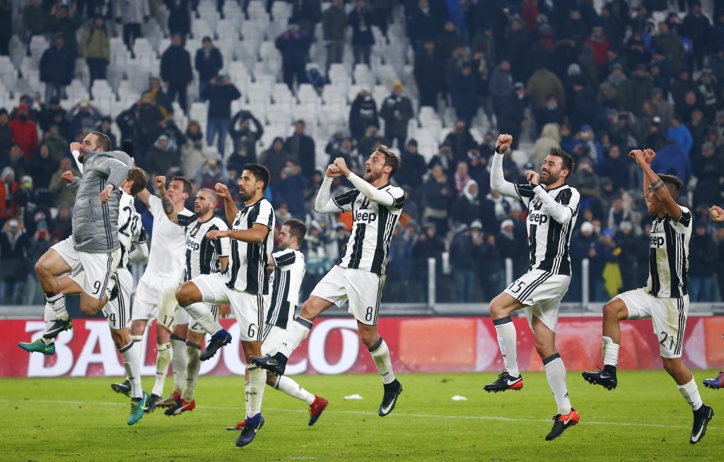 Juventus' players celebrate at the end of the match against AS Roma.