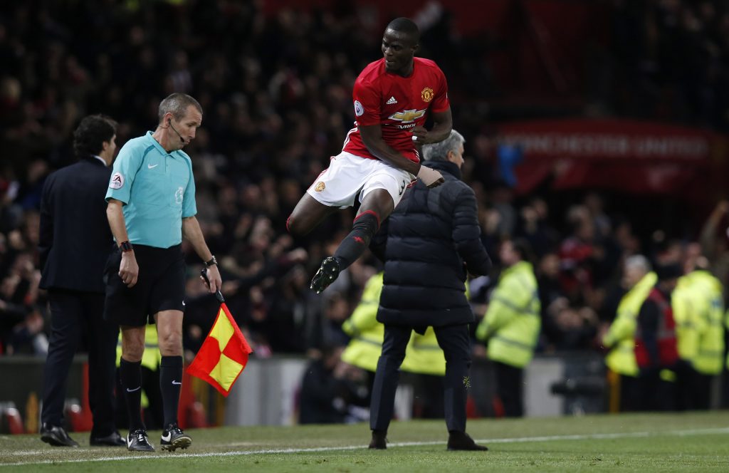 Jose Mourinho and Eric Bailly celebrate after Paul Pogba (not pictured) scores their second goal.