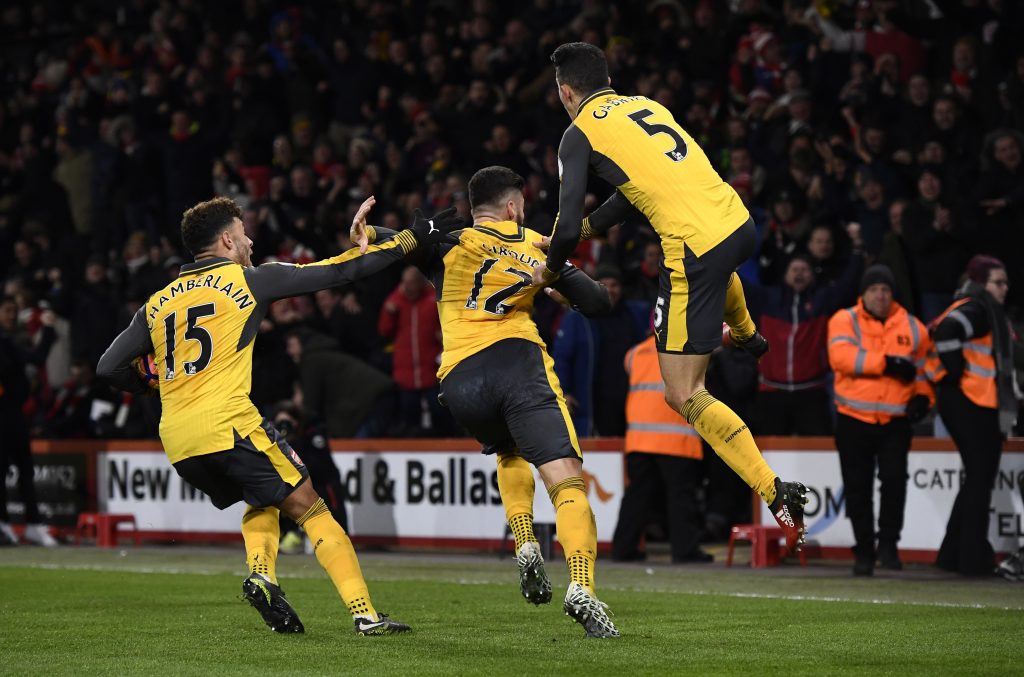 Arsenal's Olivier Giroud celebrates scoring their third goal with team mates.