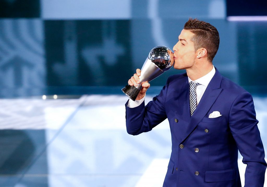 Cristiano Ronaldo celebrates with the trophy.