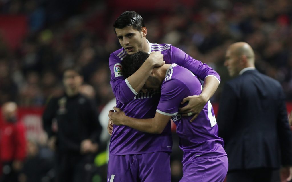 Real Madrid's Marco Asensio (R) is congratulated by team mate Alvaro Morata.