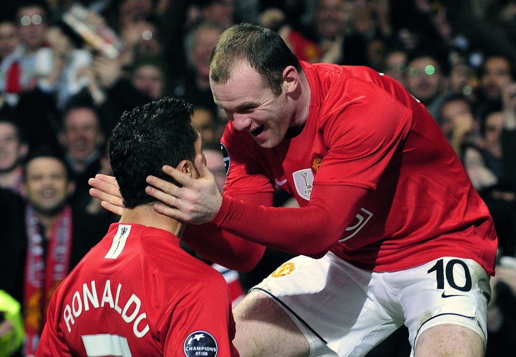 Cristiano Ronaldo (L) celebrates with Wayne Rooney after scoring during their Champions League soccer match.
