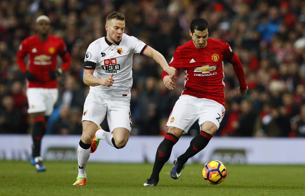 Manchester United's Henrikh Mkhitaryan in action with Watford's Tom Cleverley.