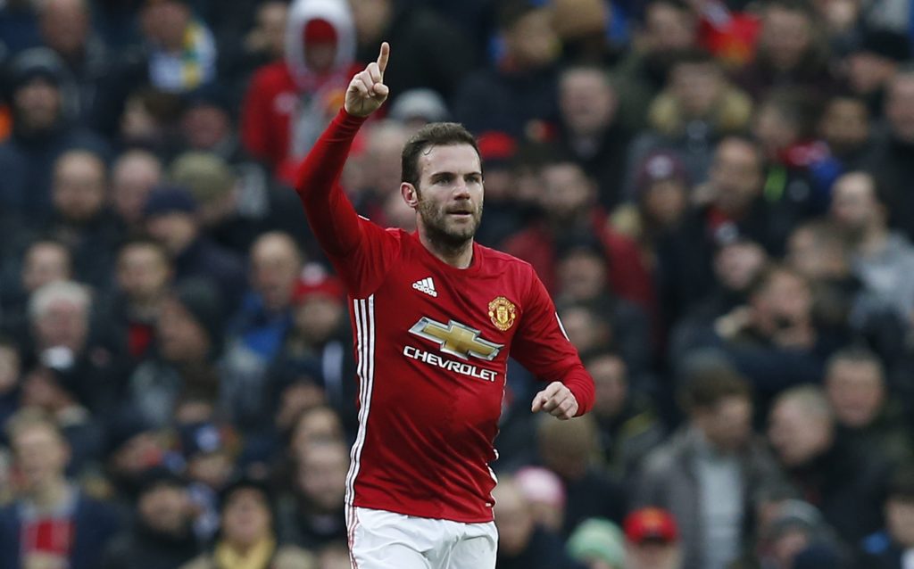 Juan Mata celebrates scoring their first goal.