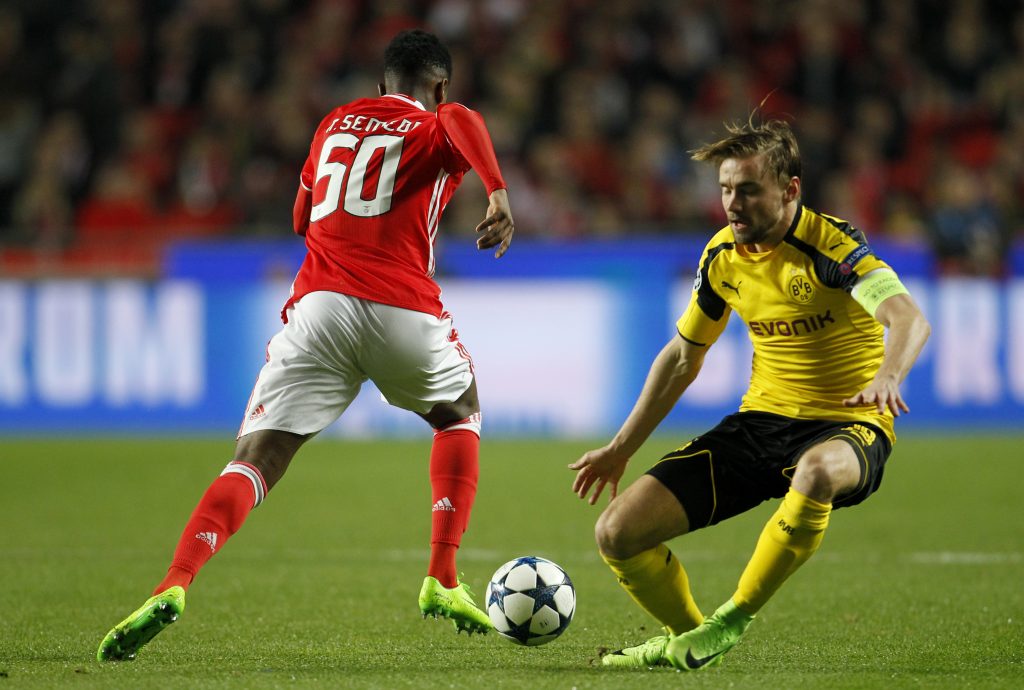 Benfica's Nelson Semedo in action with Borrusia Dortmund's Marcel Schmelzer.