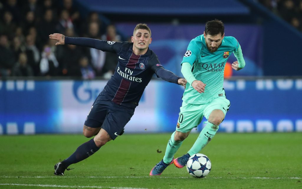 Barcelona's Lionel Messi in action with Paris Saint-Germain's Marco Verratti.