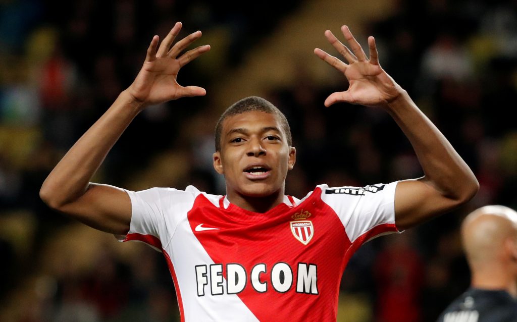 Monaco's Kylian Mbappe reacts after missing a goal.