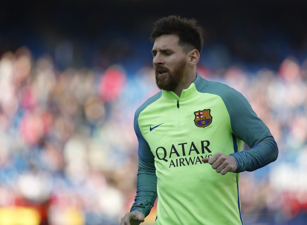 Barcelona's Lionel Messi warms up before the match.