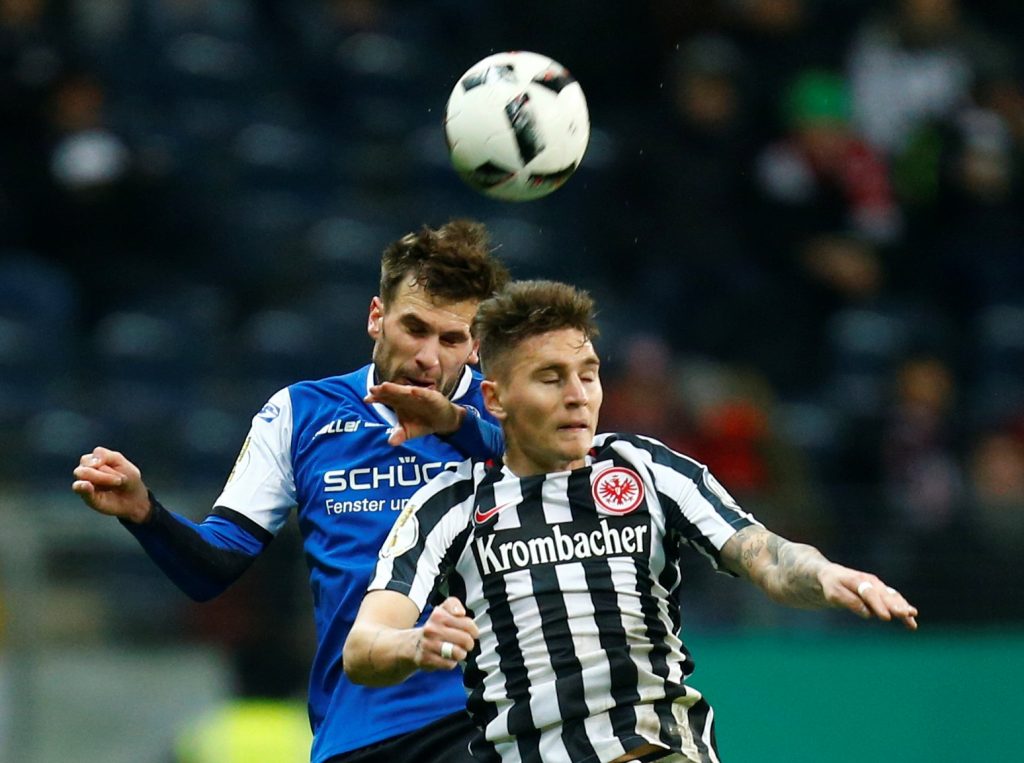 Eintracht's Guillermo Varela and Bielefeld's Christopher Noethe in action.
