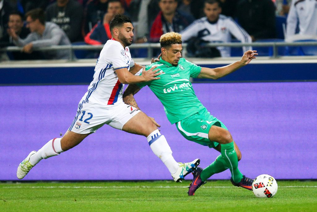 Olympique Lyon's Jordan Ferri (L) in action against St Etienne's Kevin Malcuit.