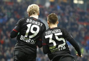 Bayer 04 Leverkusen's Julian Brandt and Vladlen Yurchenko react.