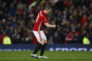Bastian Schweinsteiger celebrates scoring.