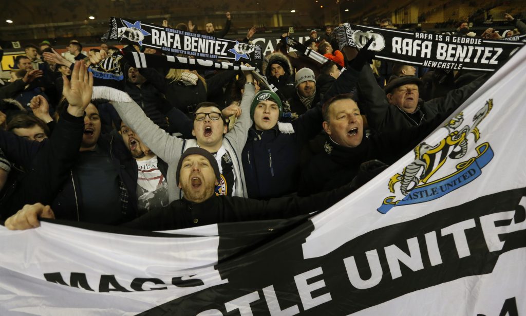 Newcastle United fans celebrate after the game.
