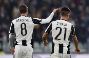 Juventus' Paulo Dybala is congratulated by his team mate Claudio Marchisio.