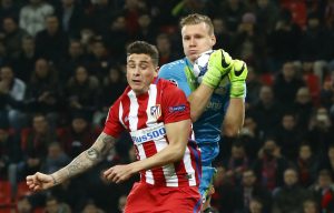 Atletico Madrid's Jose Gimenez in action with Bayer Leverkusen's Bernd Leno.
