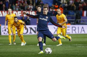 Atletico's Antoine Griezmann scores their second goal against Barcelona.