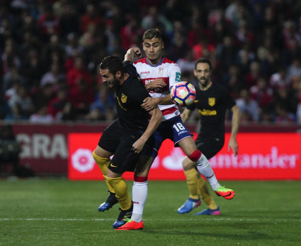 Atletico Madrid's Jorge "Koke" Resurrecion and Granada's Andreas Pereira in action.