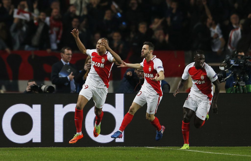 Monaco's Kylian Mbappe-Lottin celebrates with Bernardo Silva and Benjamin Mendy.