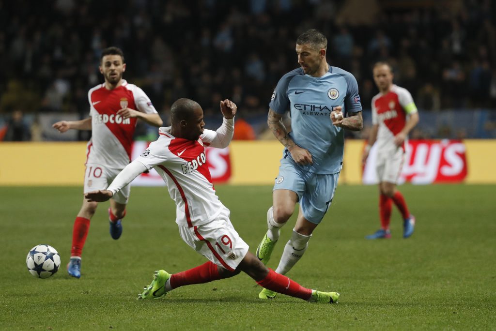 Manchester City's Aleksandar Kolarov in action with Monaco's Djibril Sidibe.