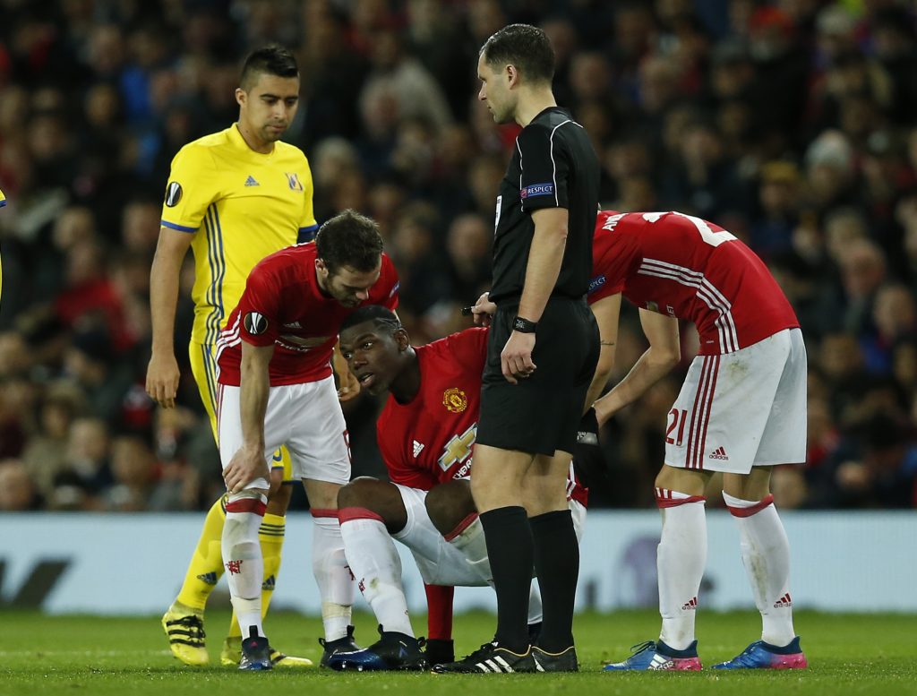 Manchester United's Paul Pogba sustains an injury before being substituted.