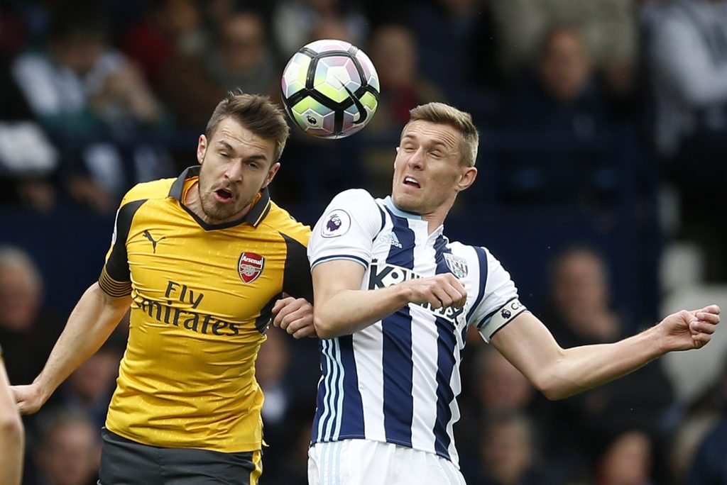 Arsenal's Aaron Ramsey in action with West Bromwich Albion's Darren Fletcher.