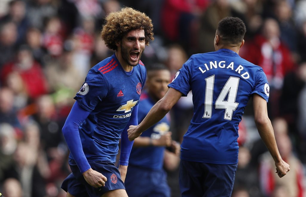 Marouane Fellaini celebrates scoring.