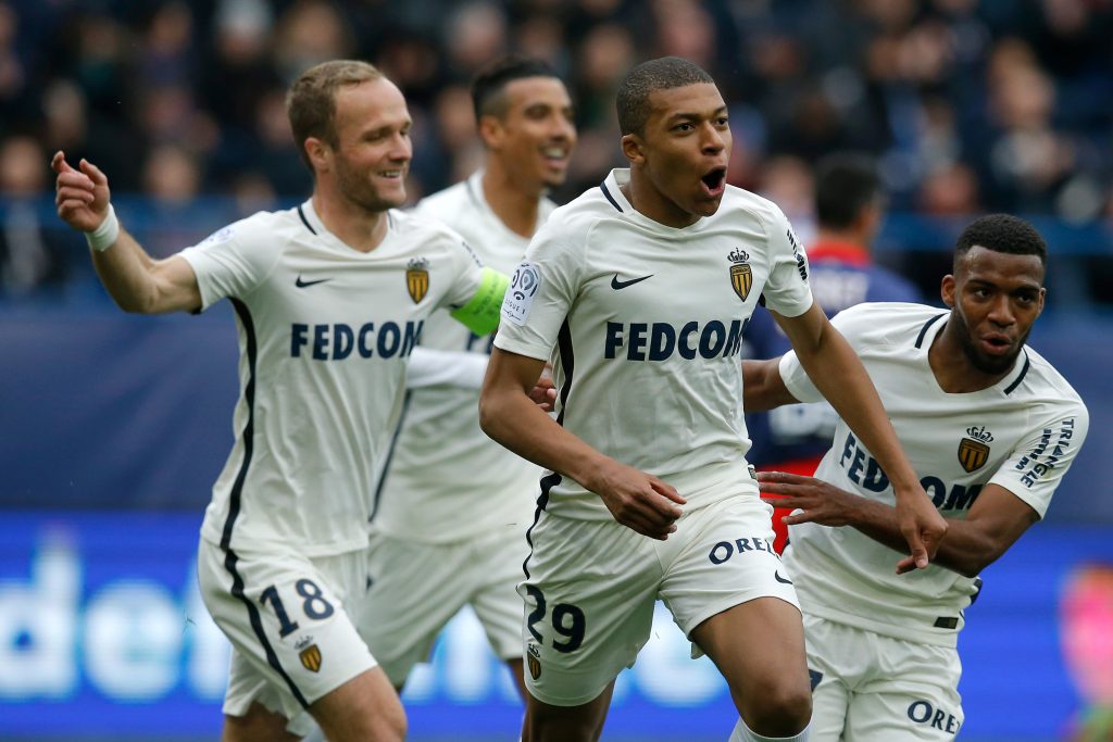 Monaco's Kylian Mbappe celebrates with team mates.