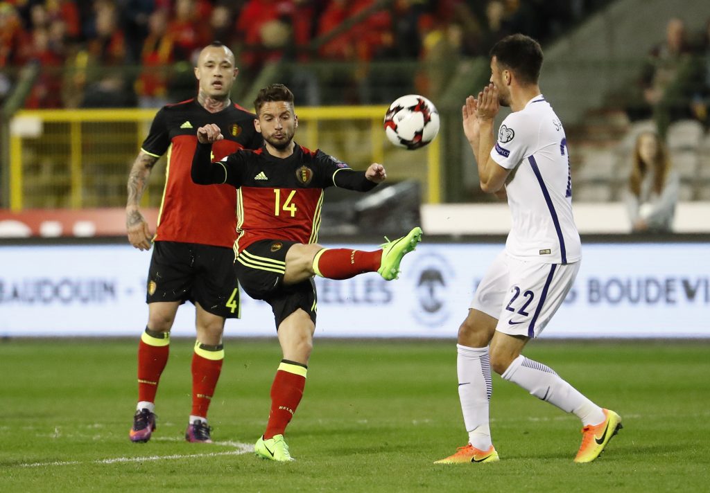 Belgium's Dries Mertens in action with Greece's Andreas Samaris.